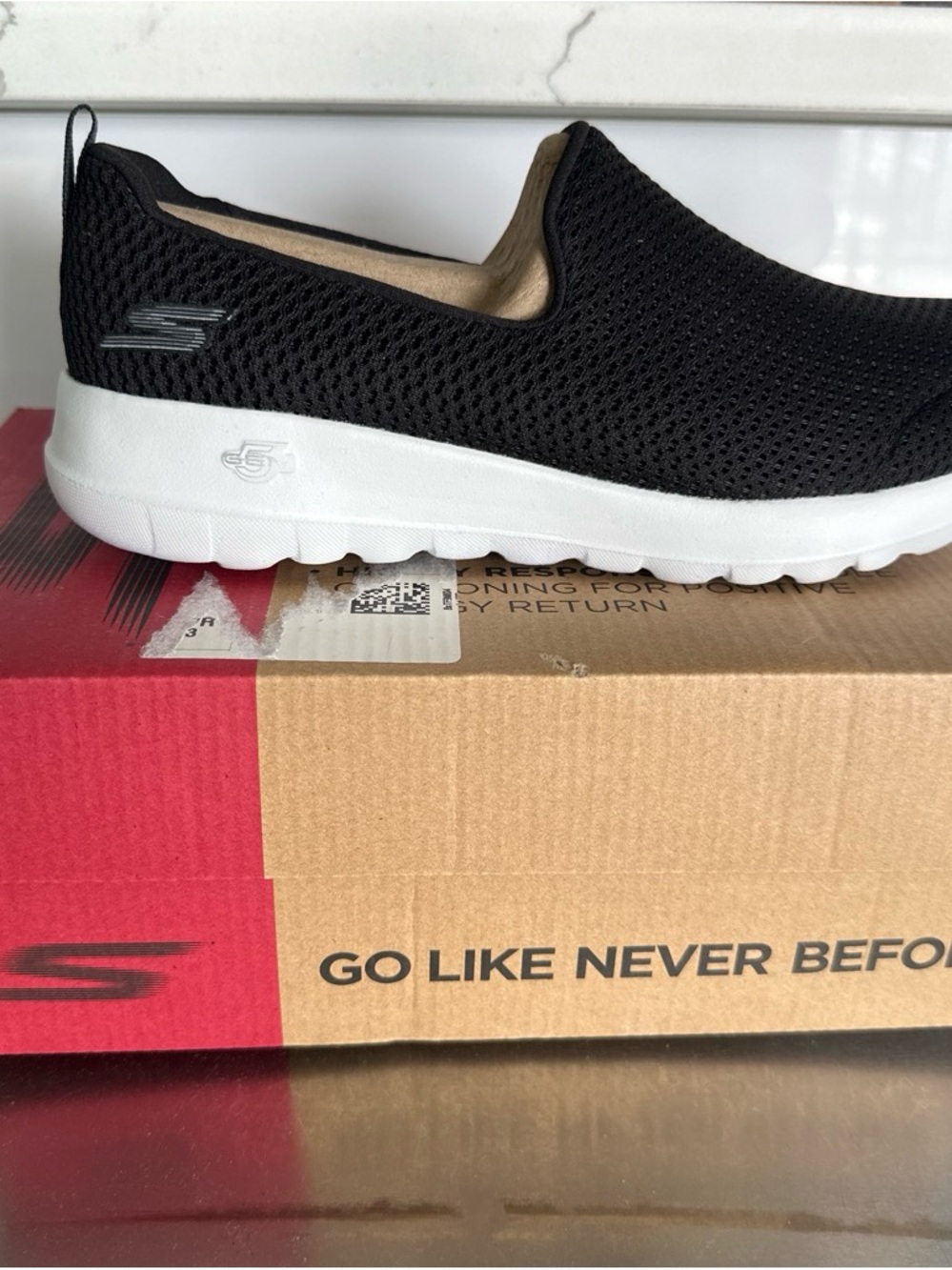 Skechers Black Knit Slip-On Sneakers with White Sole